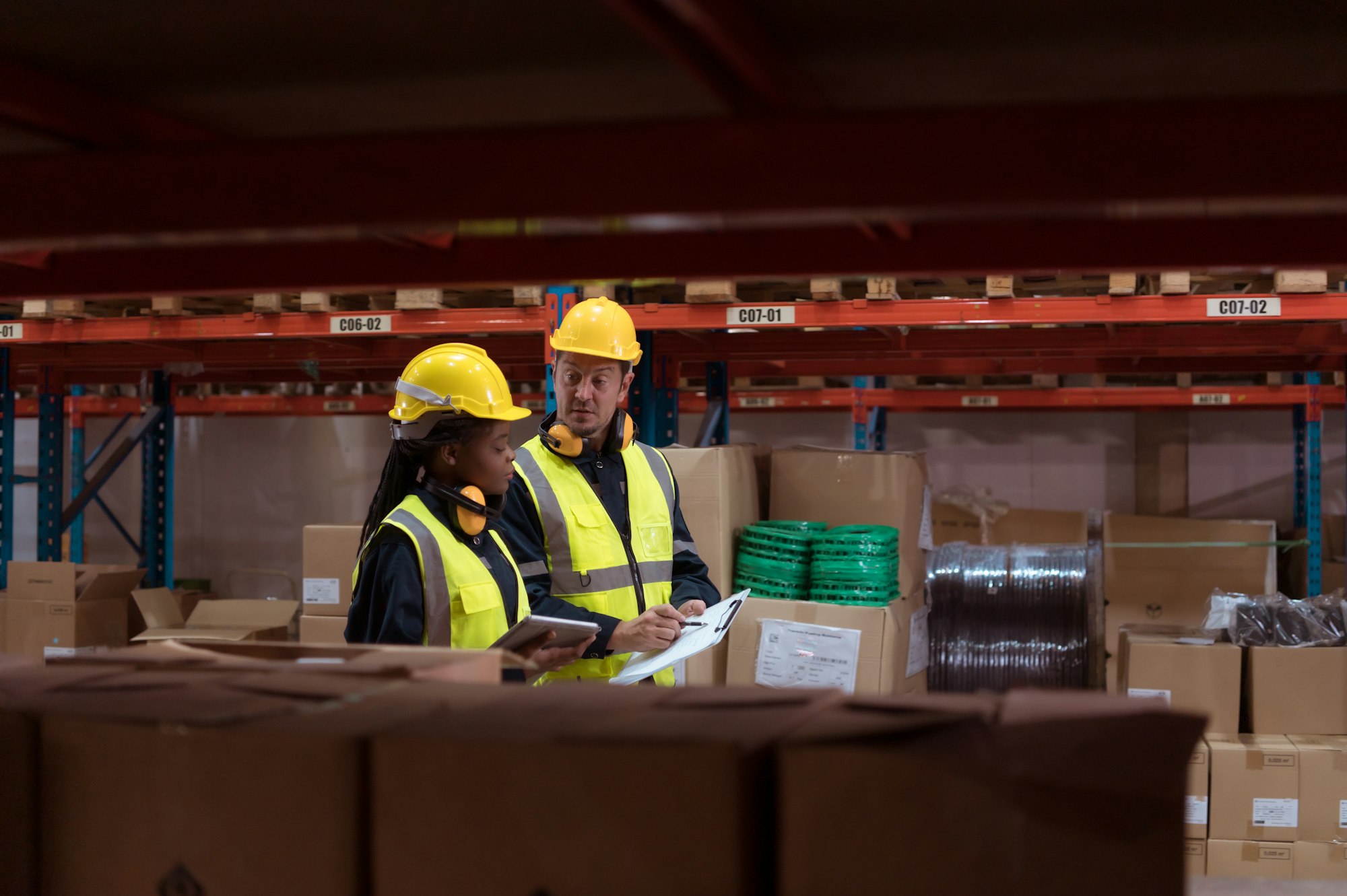 Warehouse foreman and employees Check the imported products in the central warehouse.